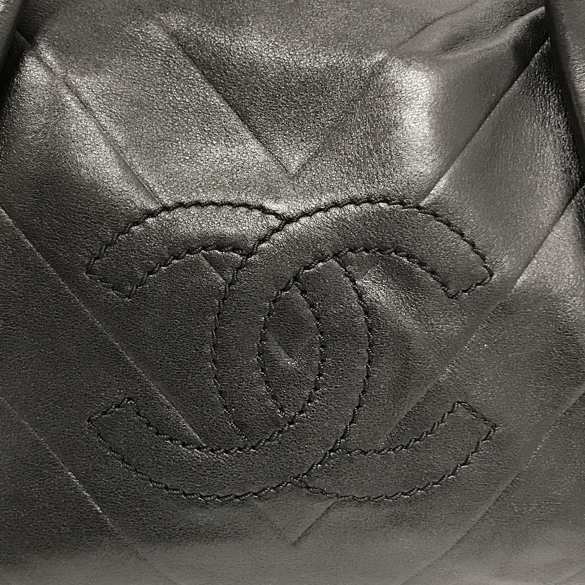 Used Chanel Mini Boston Handbag with Chevron and Coco Mark in Black Leather