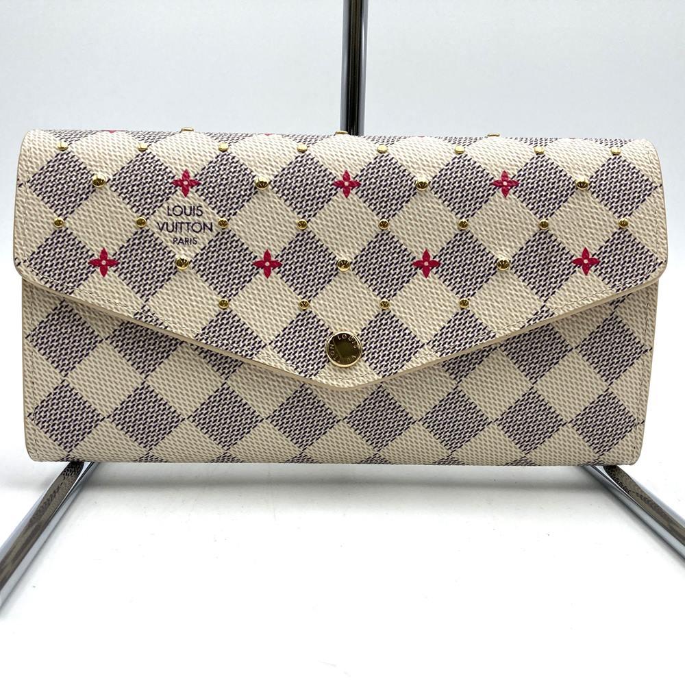 Louis Vuitton Portefeuille Sarah N45296, a cute bifold long wallet with flower studs, made of Damier Azur canvas in beige/pink.