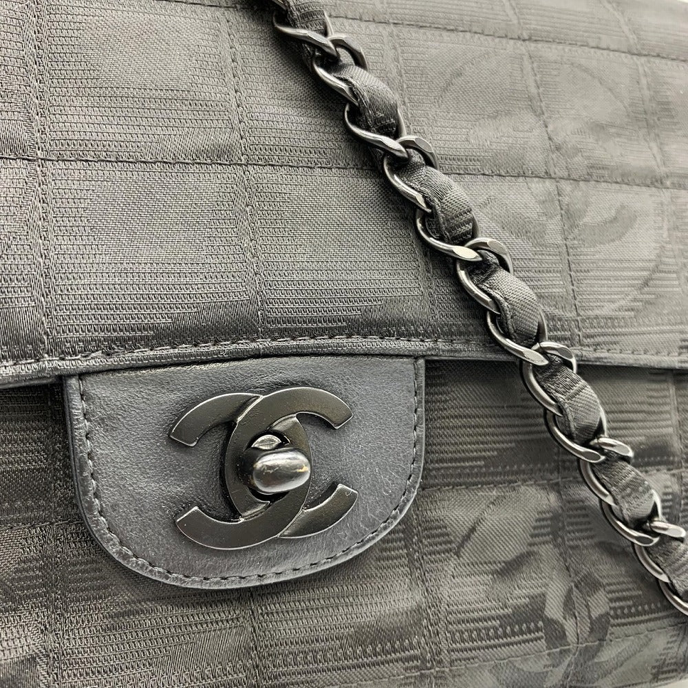 Excellent condition CHANEL New Travel Line Chocolate Bar Chain Shoulder Bag, Nylon, Coco Black.