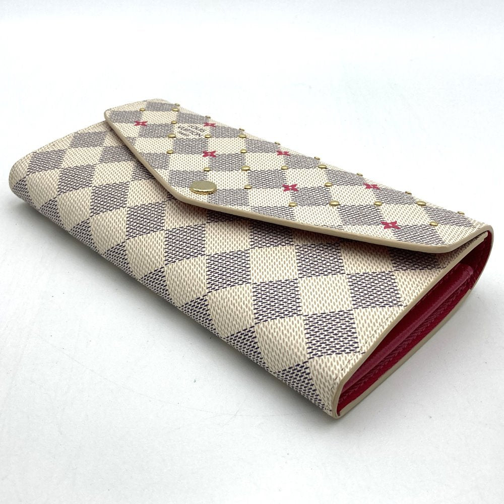 Louis Vuitton Portefeuille Sarah N45296, a cute bifold long wallet with flower studs, made of Damier Azur canvas in beige/pink.
