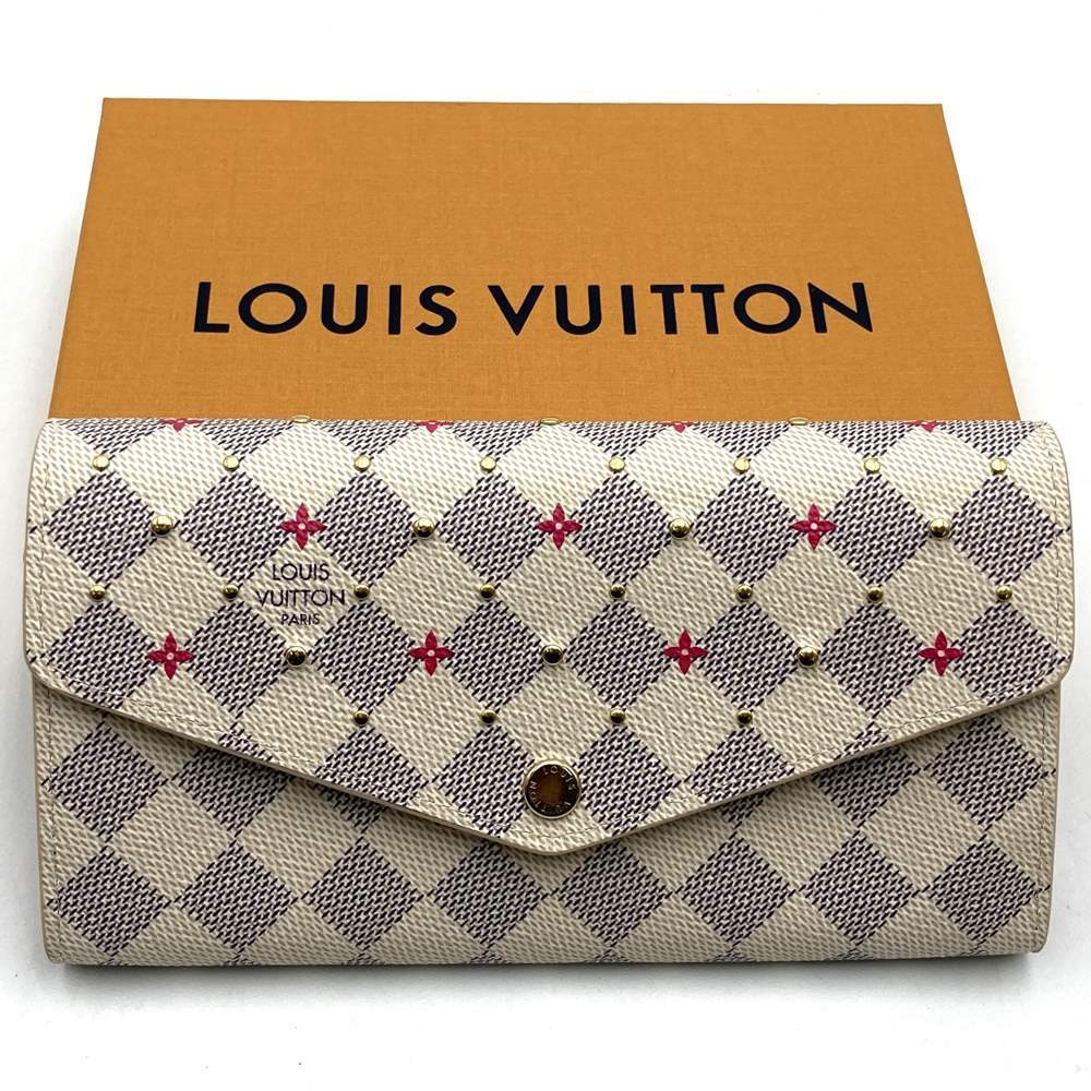 Louis Vuitton Portefeuille Sarah N45296, a cute bifold long wallet with flower studs, made of Damier Azur canvas in beige/pink.