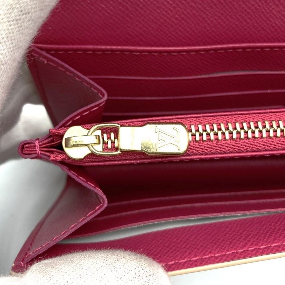 Louis Vuitton Portefeuille Sarah N45296, a cute bifold long wallet with flower studs, made of Damier Azur canvas in beige/pink.